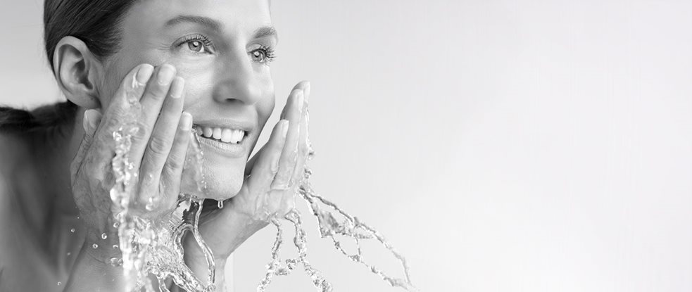 Woman washing her face