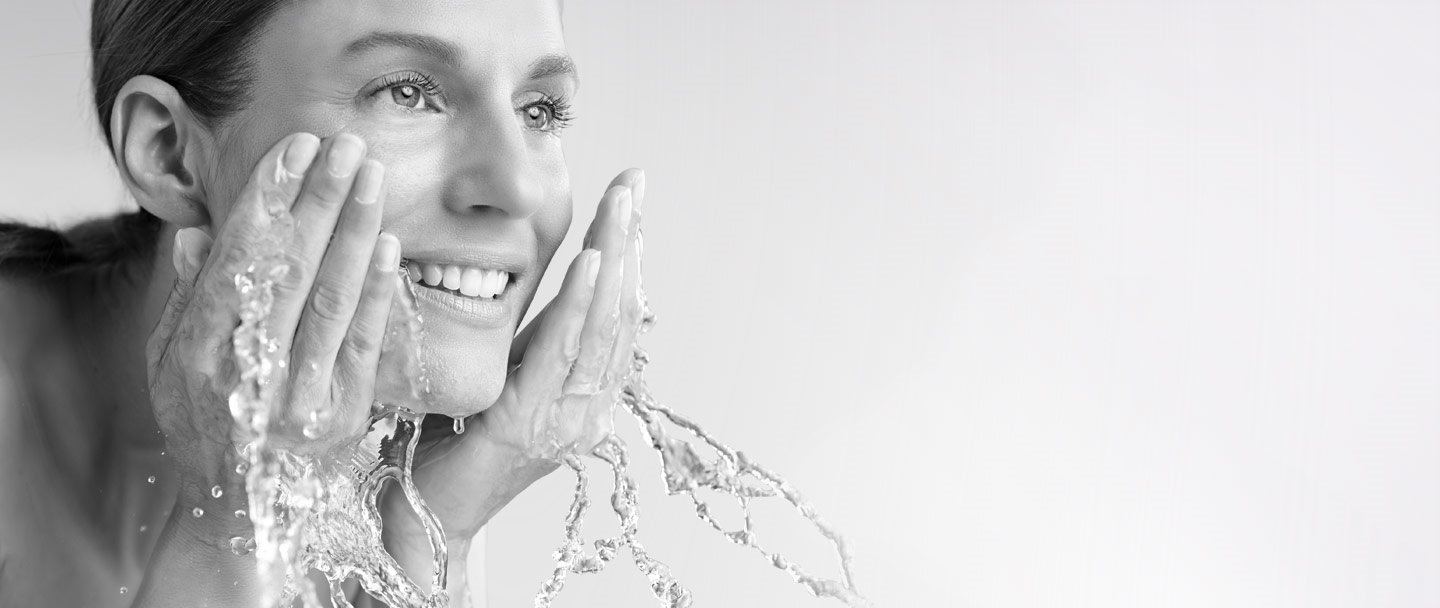 Woman washing her face