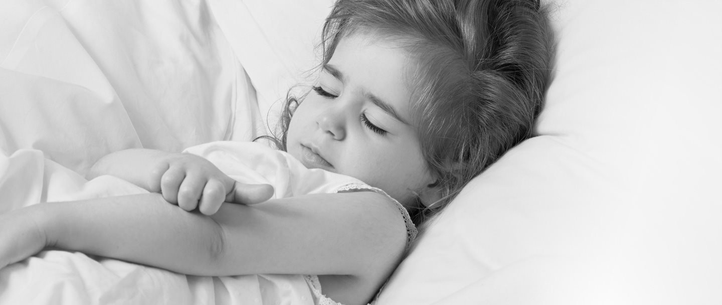 Little girl scratching the crook of her arm.