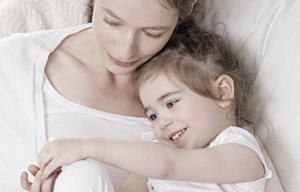 Mother and child cuddling.