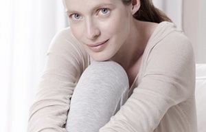 Woman in a relaxed pose with cocked leg.